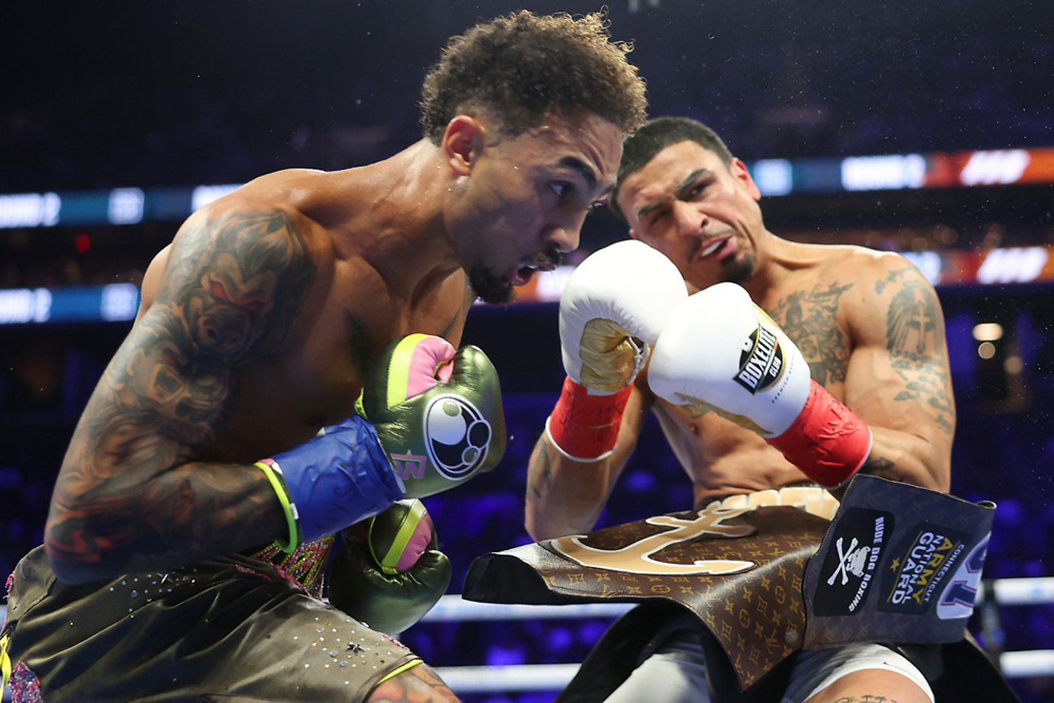 Ben Whittaker lands a left hand on Richard Popeye Rivera in their light-heavyweight fight at Barclays Center, Rivera wearing BOXELITE gloves