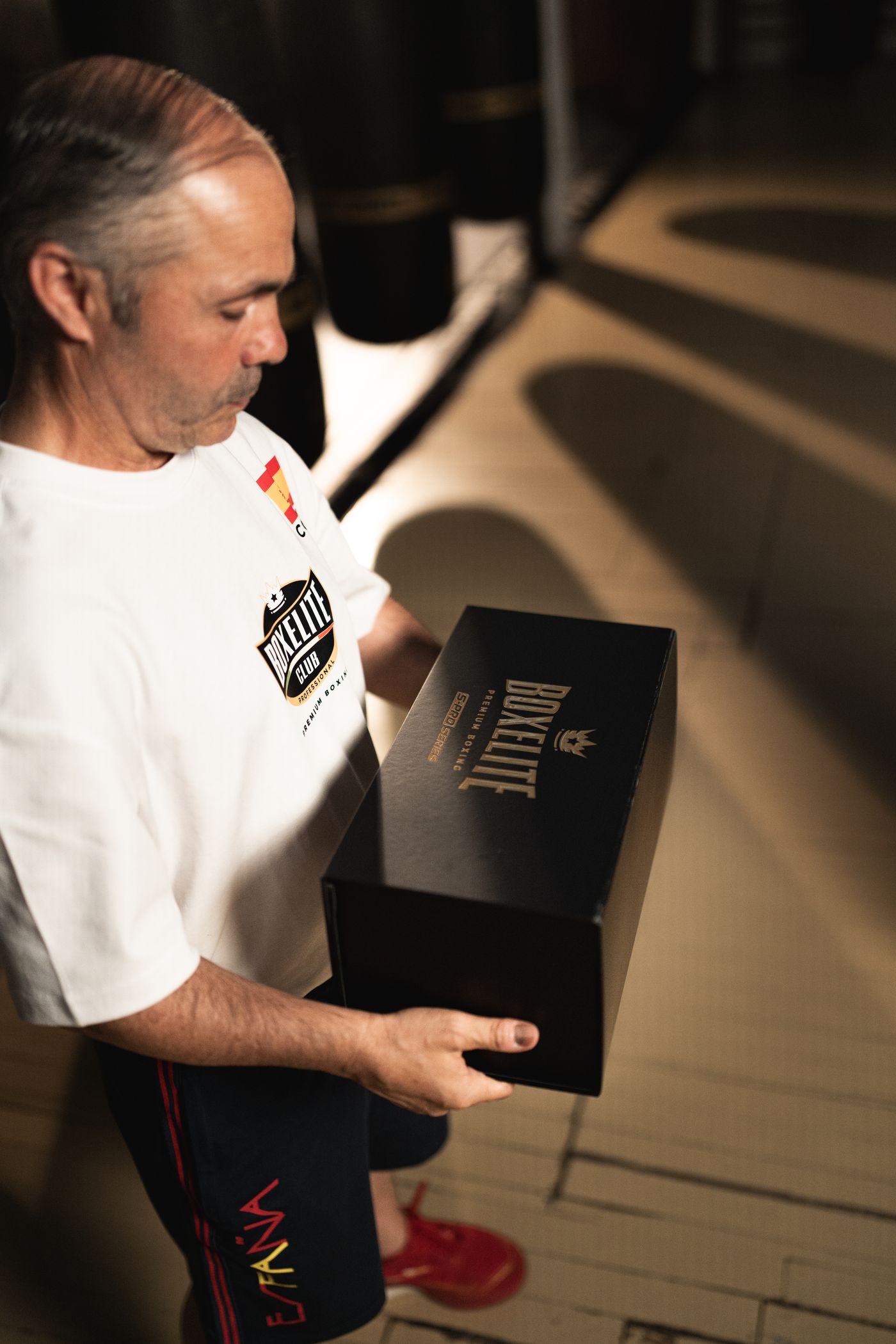 Rafael Lozano Sr holding the matte black BOXELITE S-PRO Series presentation box with gold foil logo